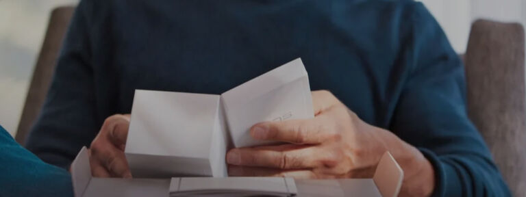 Gold IQOS DUO on a laptop